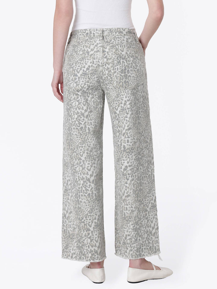 Neutral gray and cream leopard print wide-leg jeans with a high-rise drawstring waist, oversized front patch pockets, ankle length, and raw hem.