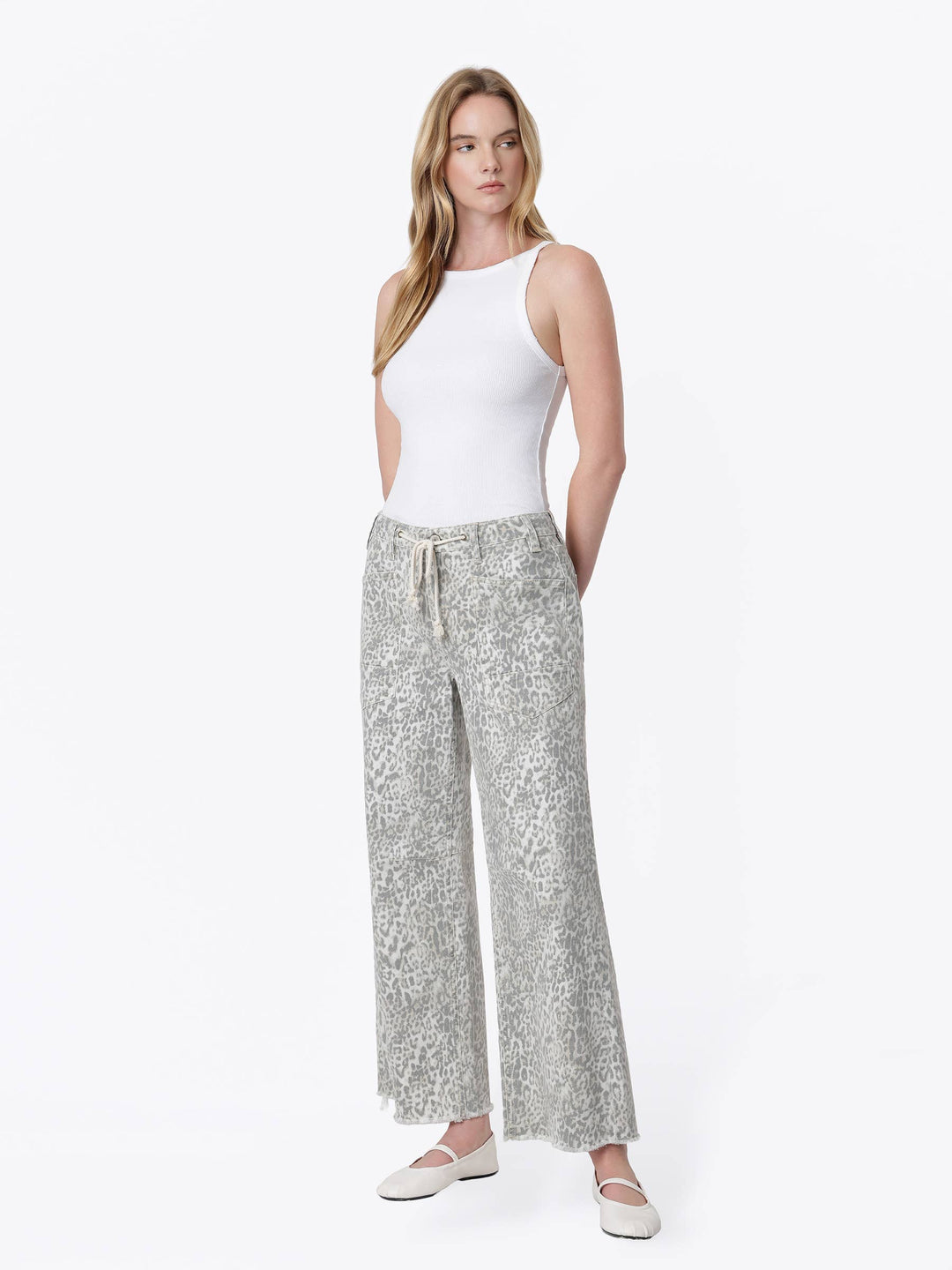 Neutral gray and cream leopard print wide-leg jeans with a high-rise drawstring waist, oversized front patch pockets, ankle length, and raw hem.