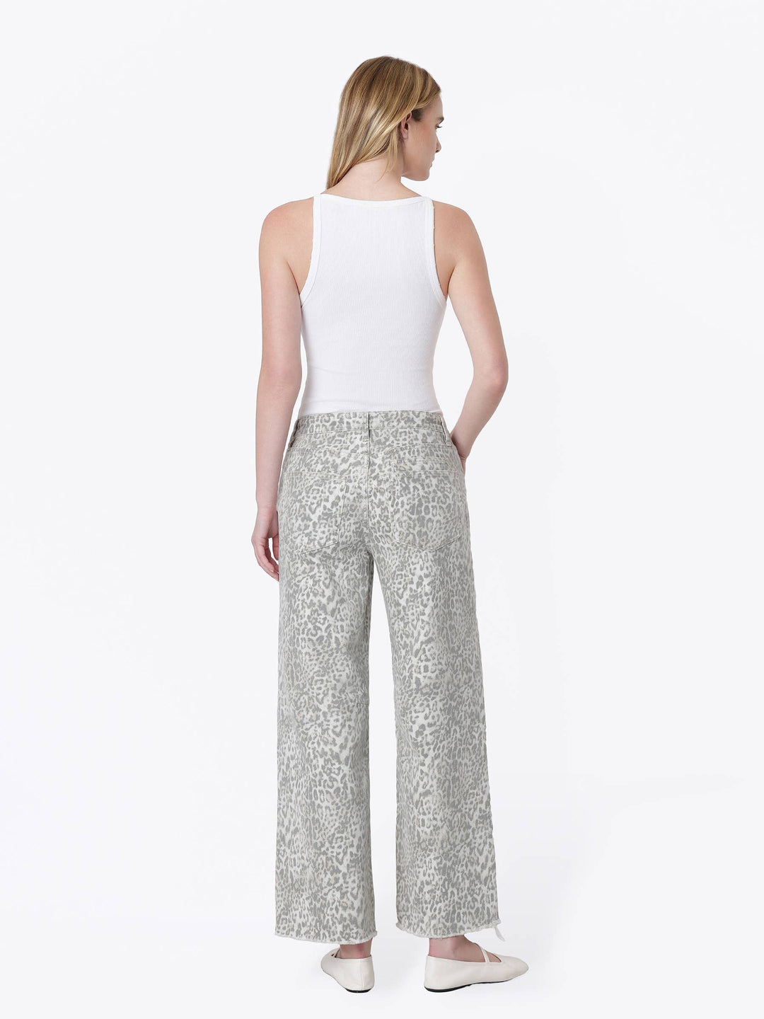 Neutral gray and cream leopard print wide-leg jeans with a high-rise drawstring waist, oversized front patch pockets, ankle length, and raw hem.